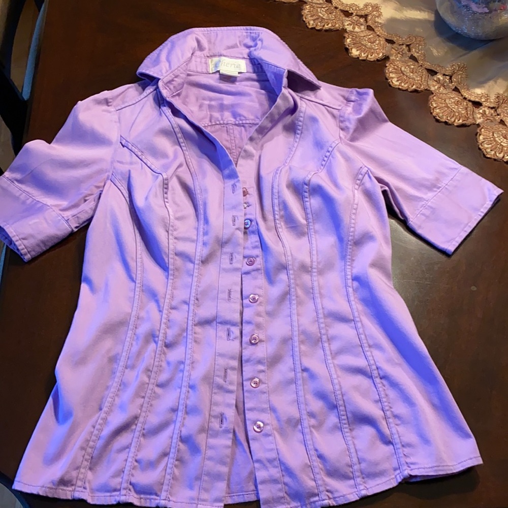 Lavender color shirt.
